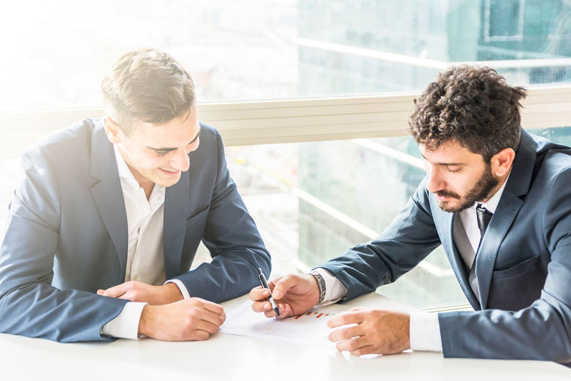 Photo of two men having a meeting