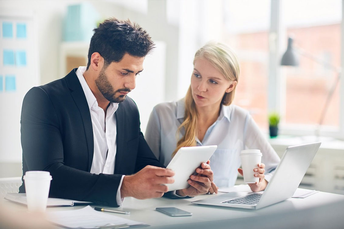 Photo of a man and woman in a meeting