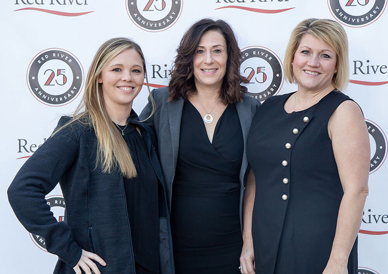 Photo of Tara Stark with two women at an event